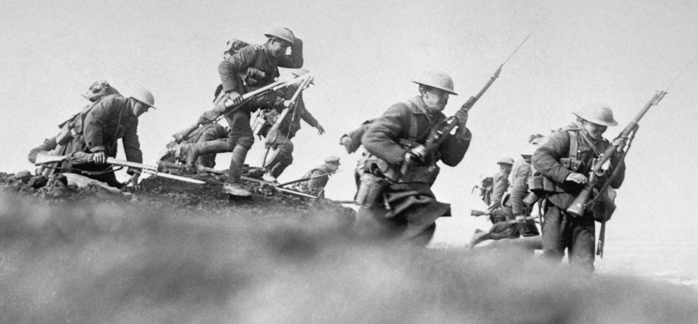 Soldiers going over the top of the trenches